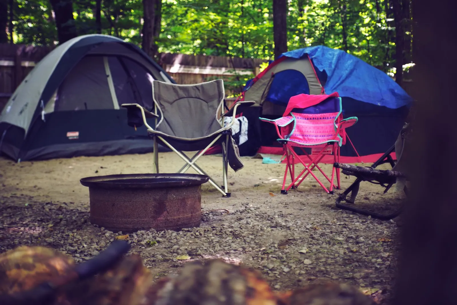 Dome tent pitched at a campsite in the evening